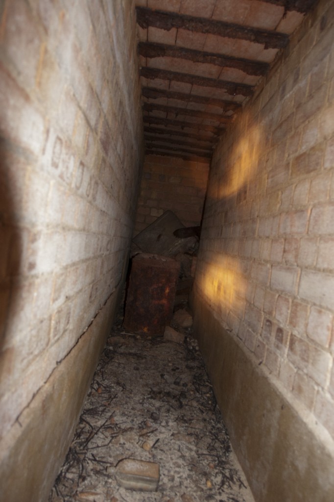 There was a 90 degree turn to the left at the end of the central corridor, and this is what was around the corner... another corridor! It turns right at the end, but that passage is blocked