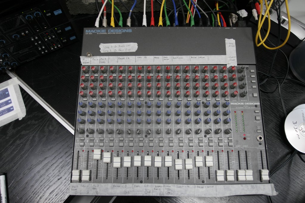 The Mackie mixer was used to control the live session monitor mix. The strips of tape are labelled to show what is being fed to each channel.