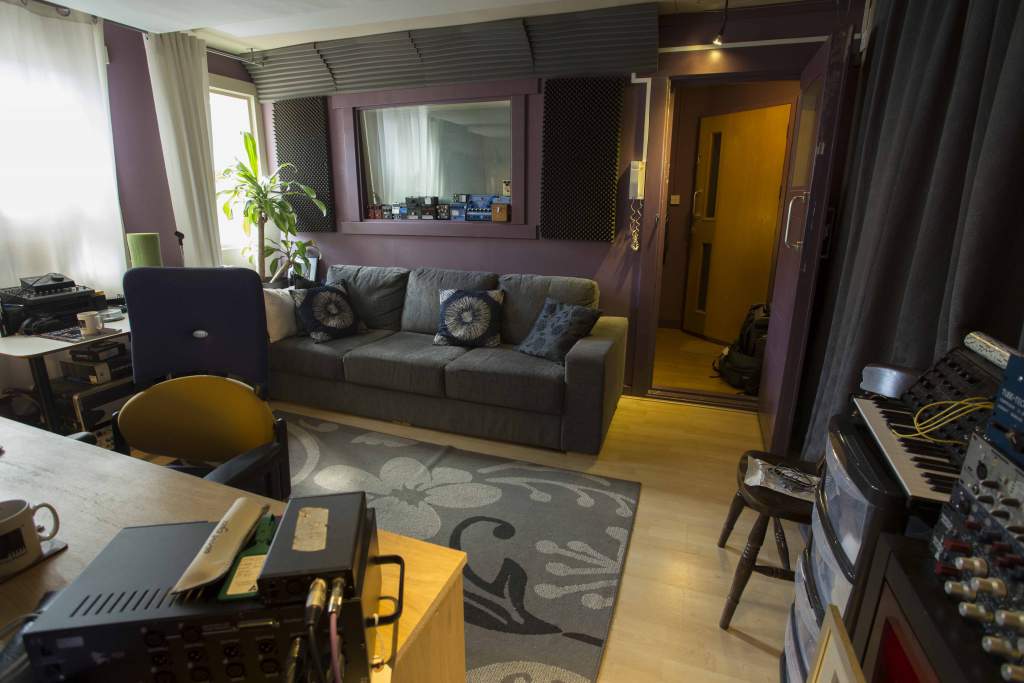 The window to Guy's vocal booth can be seen above the sofa